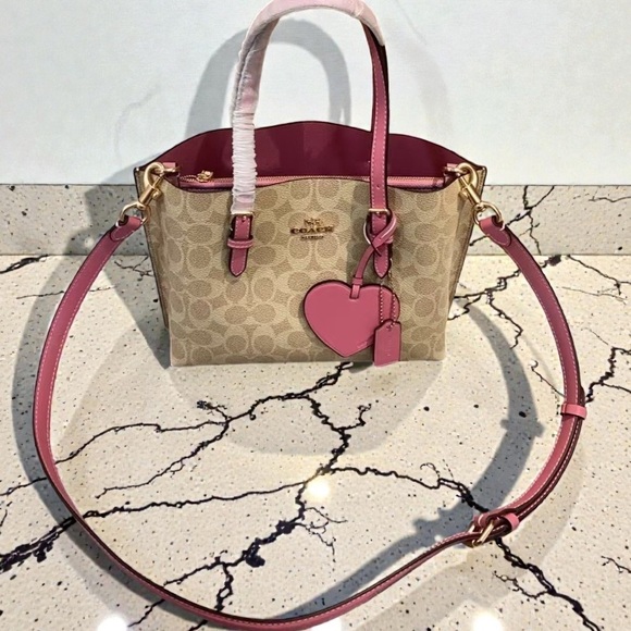 Coach Handbags - ✨Coach Pink Signature Canvas Crossbody Tote